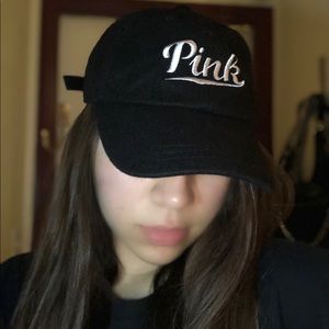 A black adjustable unused PINK hat